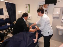 PhotoID:12569, Sonosite Australasia clinical applications specialist Lynette Hassall demonstrates ultrasound techniques to medical sonography student Amanda MacGill. 