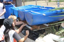 PhotoID:11737, Glenmore High students fitting the bell siphons into the drainage pipe