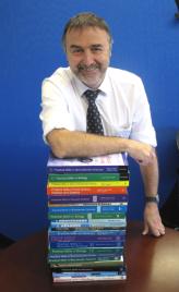 PhotoID:13020, Professor Rob Reed takes stock of his textbook series