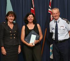 PhotoID:5091, CDFVR Director at CQU Mackay, Heather Nancarrow, receiving the Australian Crime and Violence Prevention award for the Indigenous Family Violence Prevention Forum from Minister for Police and Corrective Services, Judy Spence and being congratulated by Police Commissioner, Bob Atkison.