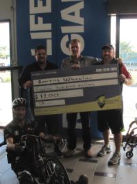 PhotoID:12635, (L-R): Rockhampton wheelchair basketballer Jason Holohan, Giant Rockhampton's Troy Mogg,  Associate Professor Peter Reaburn and Sporting Wheelies Association's Mike Oxley