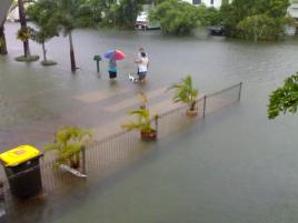 PhotoID:5393, Mackay residents chat in the streets of water after the incredible rainfall drenched the city.