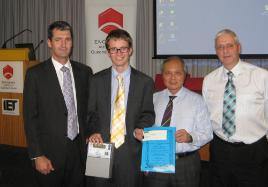 PhotoID:9865, L-R: Trevor Gear (Manager Demand Planning and Facilitation, Ergon); runner-up John Quinn; Associate Professor Ken Kwong (CQUniversity staff representative), and Clive Tudge, Past-Chairman of IET Queensland and Chairman of the judging panel