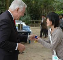 PhotoID:4524, Acting Mayor, Cr Jim Webber presents a gift to one of the Ibusuki students