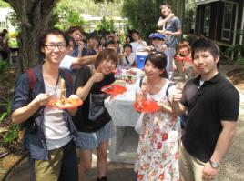 PhotoID:14066, Former study tour student Yuki Roppongi (left) and current Toyo Uni student group leader Ryoto Sato (right) chat with other students from Toyo during a welcome barbecue on Rockhampton Campus