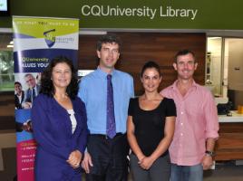 PhotoID:14494, Telstra Business reps Lydia Van Niekerk (left) and Adele Gibson discussing research potential with Professor Owen Nevin and Dr Dave Swain from CQUniversity