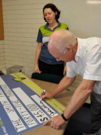 PhotoID:7549, Professor Rickard signs up to the latest agreement in the presence of Tamsen Clifford-Banks from our Office of Development and Graduate Relations