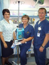 PhotoID:5265, Nurse Tracy Edwards welcomes CQU graduates Madelyn Stockwell and Dean Little to the Bundaberg Hospital.