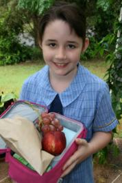 PhotoID:6793, Primary school student Annie Lawrence shows us what she thinks is needed in a healthy lunch box.