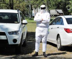 PhotoID:12178, VC Scott Bowman dresses in his 'top gear' to drive home the point about staff safety