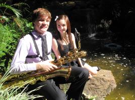 PhotoID:8999, Baritone saxophonist Luke Scott and vocalist Hannah Blomfield get a taste of playing 'down by the river' before Sunday's free show.