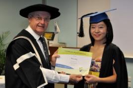 PhotoID:7319, Vice-Chancellor Professor John Rickard congratulates Mina Jung at the Going Home Ceremony.