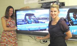 PhotoID:8831, Susan Loomes (right) and Dr Alison Owens show off the 'beach safety' segment of their student support DVD