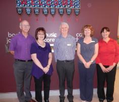 PhotoID:13011, CQUniversity Library staff L-R Director Graham Black, retiring Library Manager Pauline McNee, John Atkinson, Andrea Newton and Michelle Whiley thank Pauline for 17 years of hard work. 