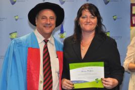 PhotoID:11540, Krissa gains her completion certificate from Executive Dean Professor Kevin Tickle