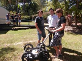 PhotoID:13041, CQUniversity Engineering students Angus Hannan, Adam Janssen and Alec O'Keefe with new GPR equipment while students Tom Bussey, Dylan Galea, Nathan Thompson and Brent Rodgers look on. 