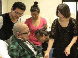 PhotoID:14056, Newly-arrived Nursing students meet up with 'Stanley' aka a masked educator, Professor Kerry Reid-Searl