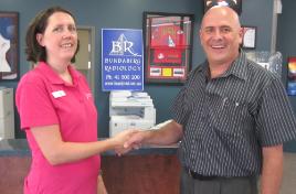 PhotoID:10617, Bundaberg Radiology Operations Manager Graeme Cashin discusses the new scholarship with Donor Prize and Scholarship Coordinator Tamsen Clifford-Banks