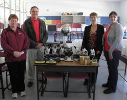PhotoID:11199, Theodore State School science teacher Jacky Sharkey, Principal Ken Treasure, CQUniversity Technical Services Manager Sue Ferguson and Laboratory Supervisor Heather Smyth look over the science equipment donated to the school.