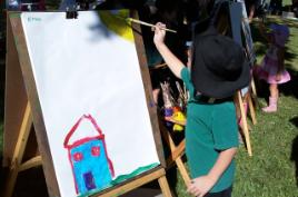 PhotoID:8929, Children enjoyed easel painting during Romp in the Park.