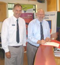 PhotoID:8129, CQUniversity Bundaberg Head Professor Phillip Clift (blue shirt) with St Luke's Principal Martin Oates