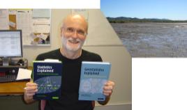 PhotoID:8951, Dr Steve McKillup with his textbooks. Also pictured are the mudflats of Keppel Sands