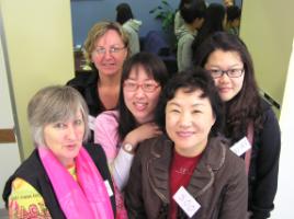 PhotoID:5875, Teresa Moore (front) and Laurel Wyte welcome Professor Soo Kim (middle) and Korean nursing students