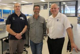 PhotoID:13009, Inaugural recipient Tim Behrens (centre) is congratulated by Professor of Horticultural Science Phil Brown and Vice-Chancellor Professor Scott Bowman