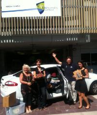 PhotoID:13983, The books leaving Noosa Campus thanks to L-R Jan Tarling (Admin Officer - Placements & School Support), Lindy Ramsay (Noosa Campus Librarian), Steve Noakes (Head of Program: Tourism & Hospitality) and Claudia Vaile (Marketing Officer, Student Recruitment)