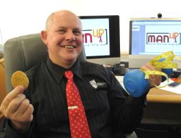 PhotoID:12413, Vice-Chancellor Professor Scott Bowman weighs the attractions of sugary food versus fitness