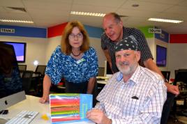 PhotoID:13471, CQUni Deputy VC Professor Hilary Winchester with 'Reforming Homework' authors Prof Mike Horsley of CQUni (front) and Prof Richard Walker of UniSyd (rear)
