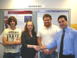 PhotoID:11180, Scholarship recipients from the Rockhampton cohort Darsy O'Neill, Laura Harbinson and Chris Slavin (L to R) being congratulated by Prof Grant Stanley, Head of Medical and Applied Sciences