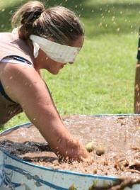 PhotoID:5427, A student searches for spuds during the spud in the mud challenge