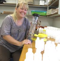 PhotoID:8068, Leigh Stitz with some of her research equipment