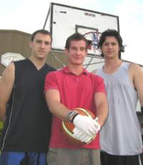 PhotoID:5540, Aaron Scanlan (centre) prepares to test Rockhampton baskbetballers Craig Bosel (left) and Tony Campbell