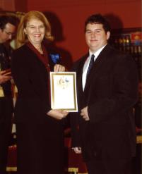 PhotoID:11804, James Mogg receives a Queen's Scout Award from the Governor of Queensland Penelope Wensley AC in a presentation in Brisbane recently