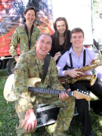 PhotoID:9227, Students Luke Scott and Hannah Blomfield get a chance to play alongside Army Band musicians Corporal Sheree Klopp and Lance Corporal Grant Thomas