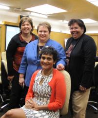 PhotoID:12926, Yvette Roe (seated) is greeted by representatives of the Office of Indigenous Engagement L-R Donna Smith, Prof Bronwyn Fredericks and Anne Munns