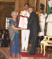 PhotoID:13607, President of India Pranab Mukherjee presents the award to Chairperson and Founder Trustee of Salaam Baalak Trust, Praveen Nair