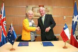 PhotoID:3935, Professor Hovenga (yellow jacket) is pictured at the Australian Embassy in Santiago for a signing ceremony between CQU and the University of Mayor.