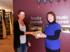 PhotoID:12549, Psychology student Angela Newman, with CQUniversity Mackay Library Manager Pauline McNee, was the winner of a Kindle electronic reader as a result of taking part in the CQUniversity Library Client Survey. 