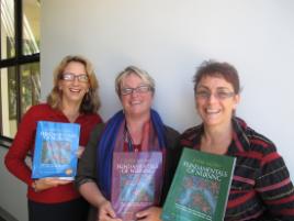 PhotoID:7528, Lorna, Kerry and Trudy with the new textbook volumes