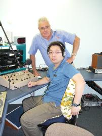 PhotoID:5745, 4YOU President Jim Gribbin and CQU student and 4YOU Chinese Radio Show presenter Tony Tao prepare for the arrival of students from City University in Hong Kong