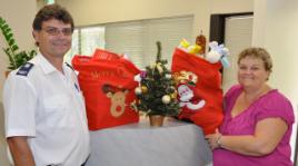 PhotoID:8157, Salvation Army's Jeff Packer thanked CQUniversity's student representative Louise Hayes for the contribution to the Christmas Appeal.