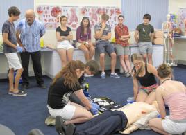 PhotoID:13725, Students take part in an emergency simulation under the gaze of their peers