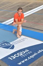 PhotoID:7247, Learning Management student and cycling talent Jay Callaghan inspects the new CQUniversity signage