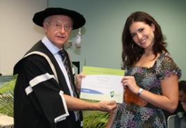 PhotoID:6424, Marissa is congratulated by the Vice-Chancellor