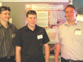 PhotoID:6497, Simon Cunningham, David Verroen and Evan Davison discuss the poster presentations