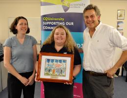 PhotoID:7632, Beef Australia CEO Noel Landry presents a gift to (from left) Tamsen Clifford-Banks and Connie-May Moore