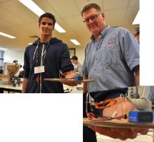 PhotoID:14968, Miguel Pengel from Toolooa High in Gladstone shows EngLink organiser Greg Millican his progress on building a motor. LINK for larger images